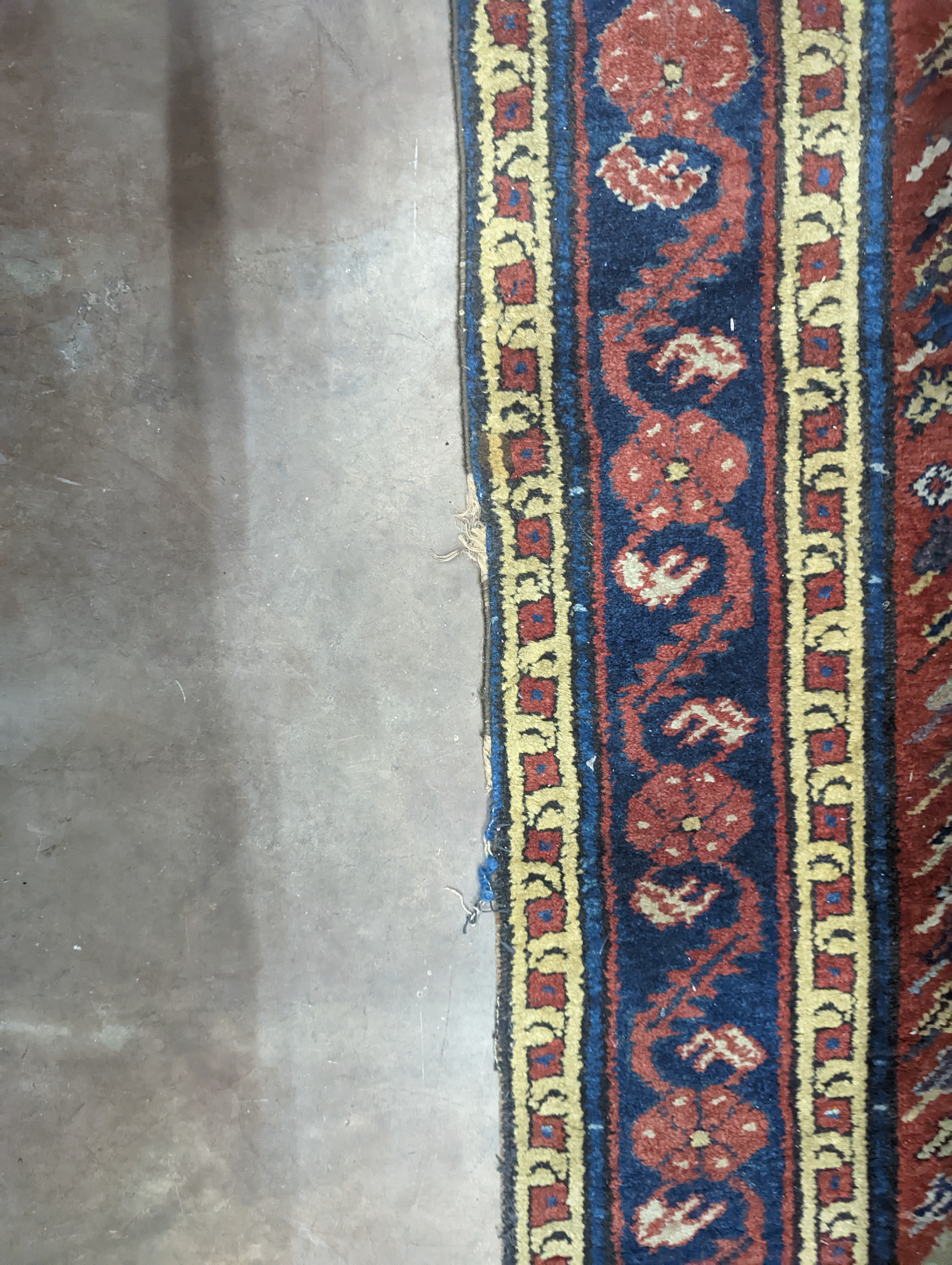 A Caucasian design brick red ground runner, 430 x 80cm